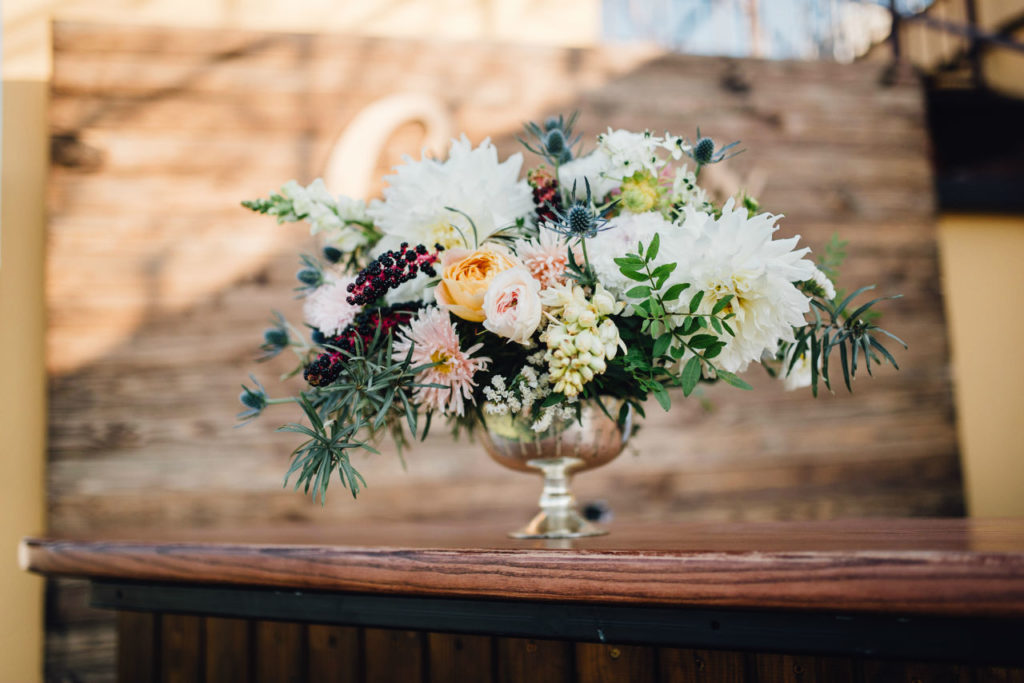 Elegant mixed flower centerpiece in silver vase