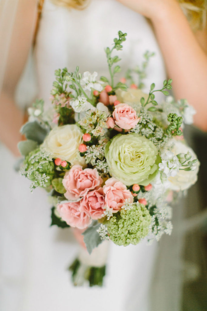 Bride holding pastel pink and green bouquet