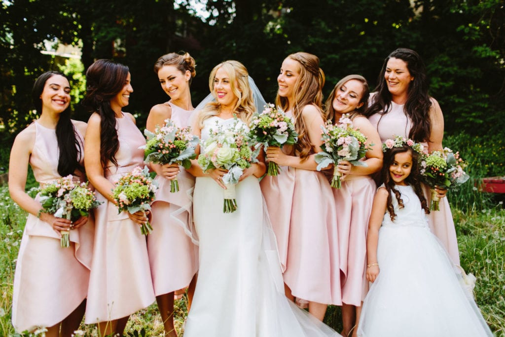Bride with bridesmaids in blush pink dresses